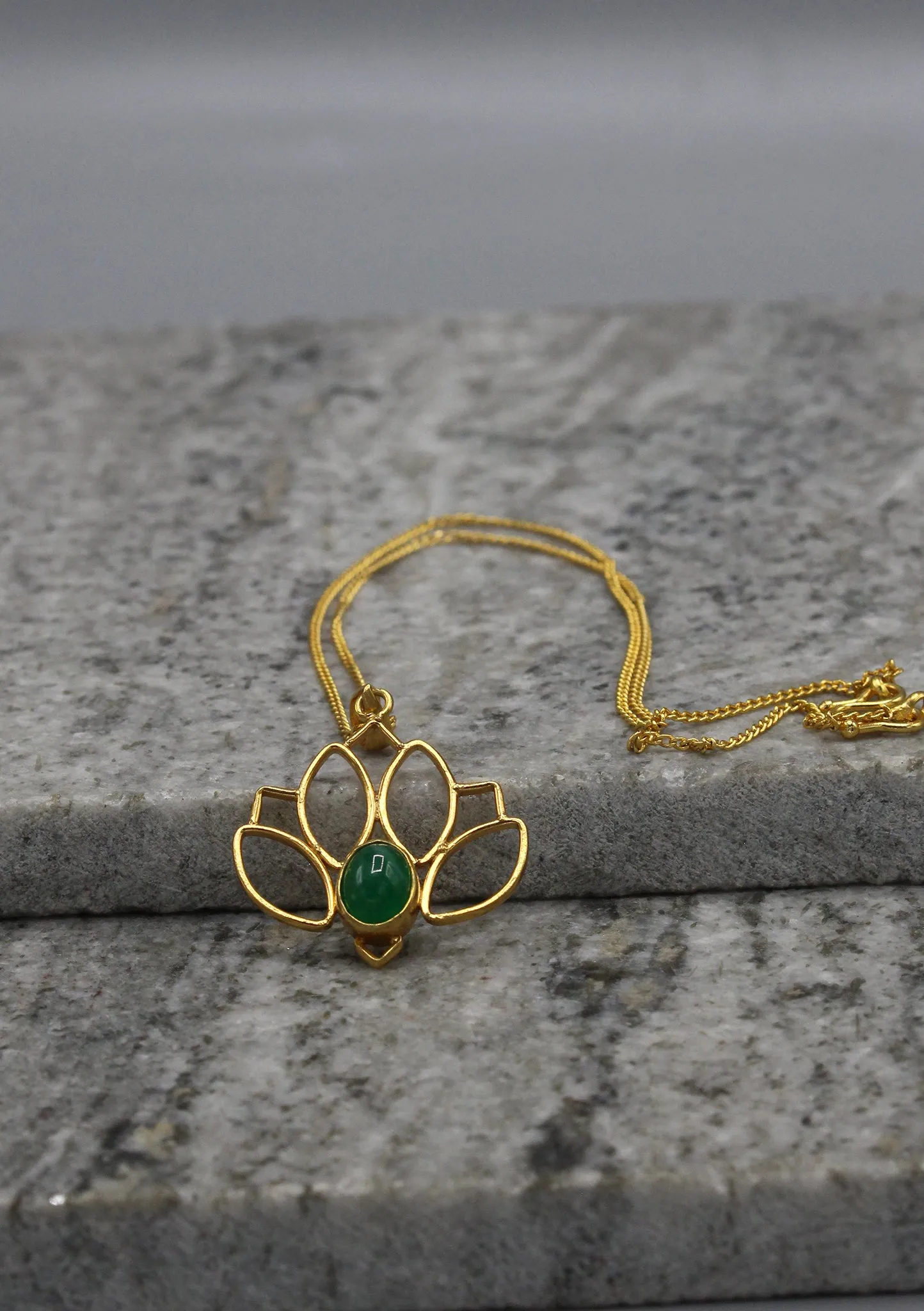 Elegant Emerald inlaid Gold Plated Lotus Pendant