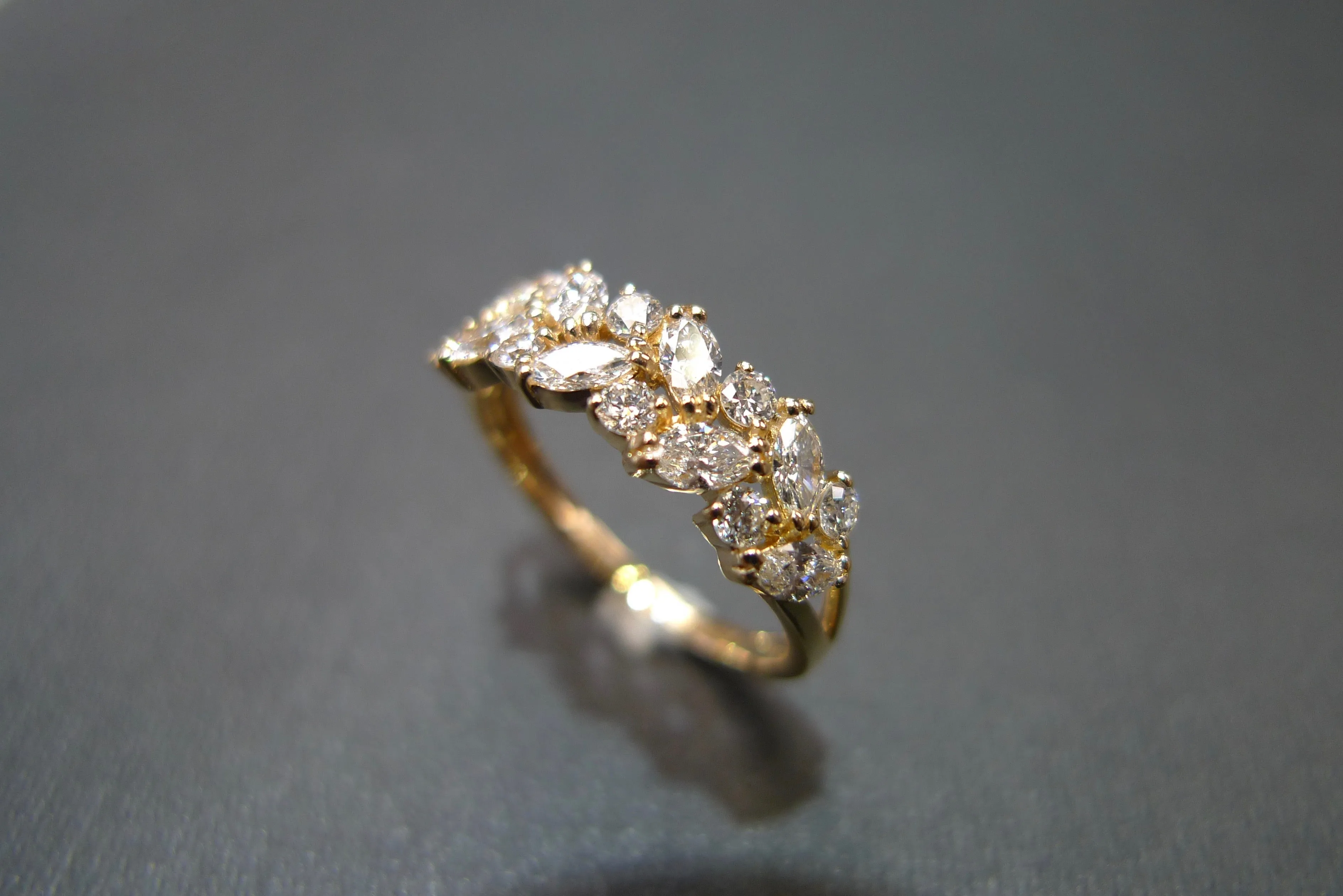 Marquise Cut Diamond and Round Brilliant Cut Diamond Ring in Yellow Gold