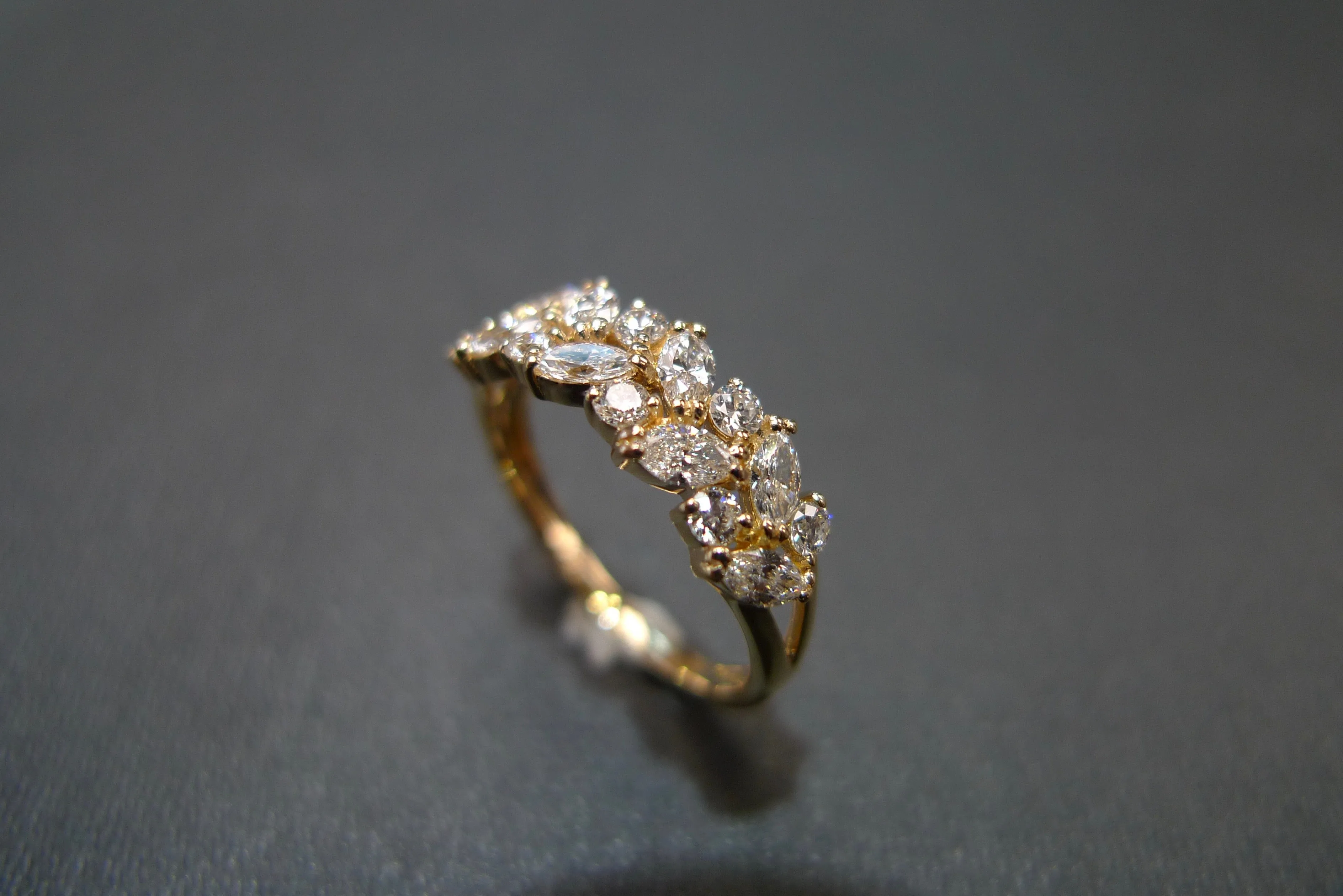 Marquise Cut Diamond and Round Brilliant Cut Diamond Ring in Yellow Gold