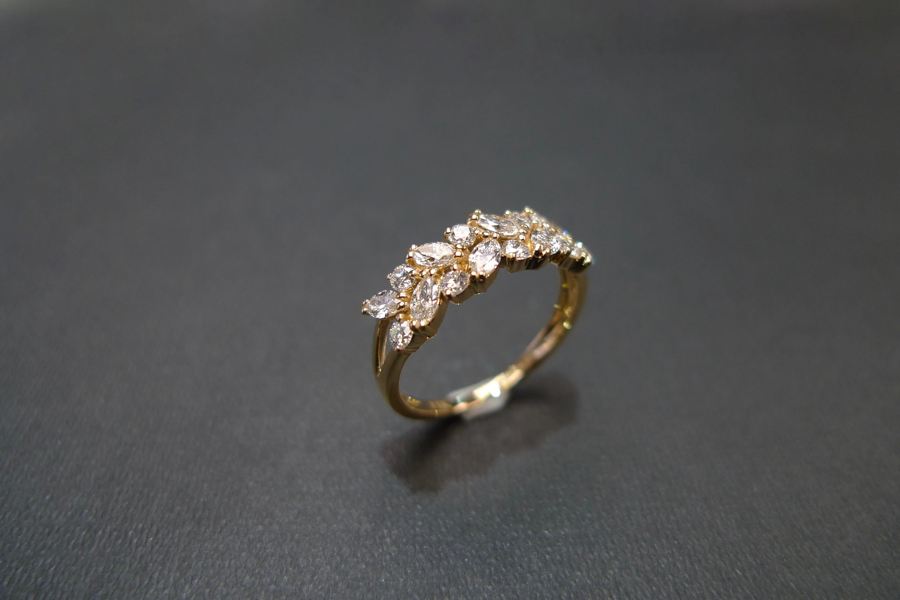 Marquise Cut Diamond and Round Brilliant Cut Diamond Ring in Yellow Gold