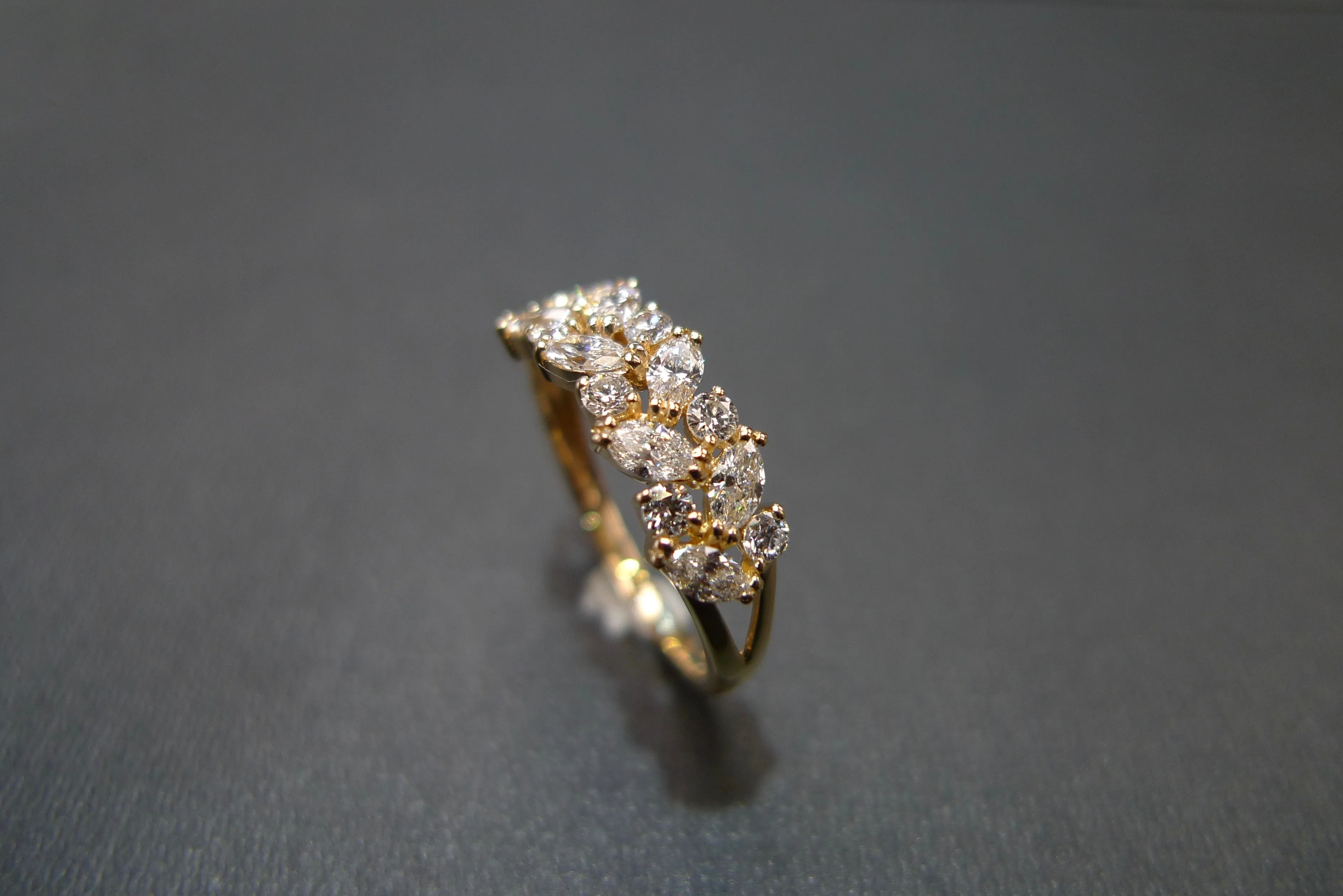 Marquise Cut Diamond and Round Brilliant Cut Diamond Ring in Yellow Gold