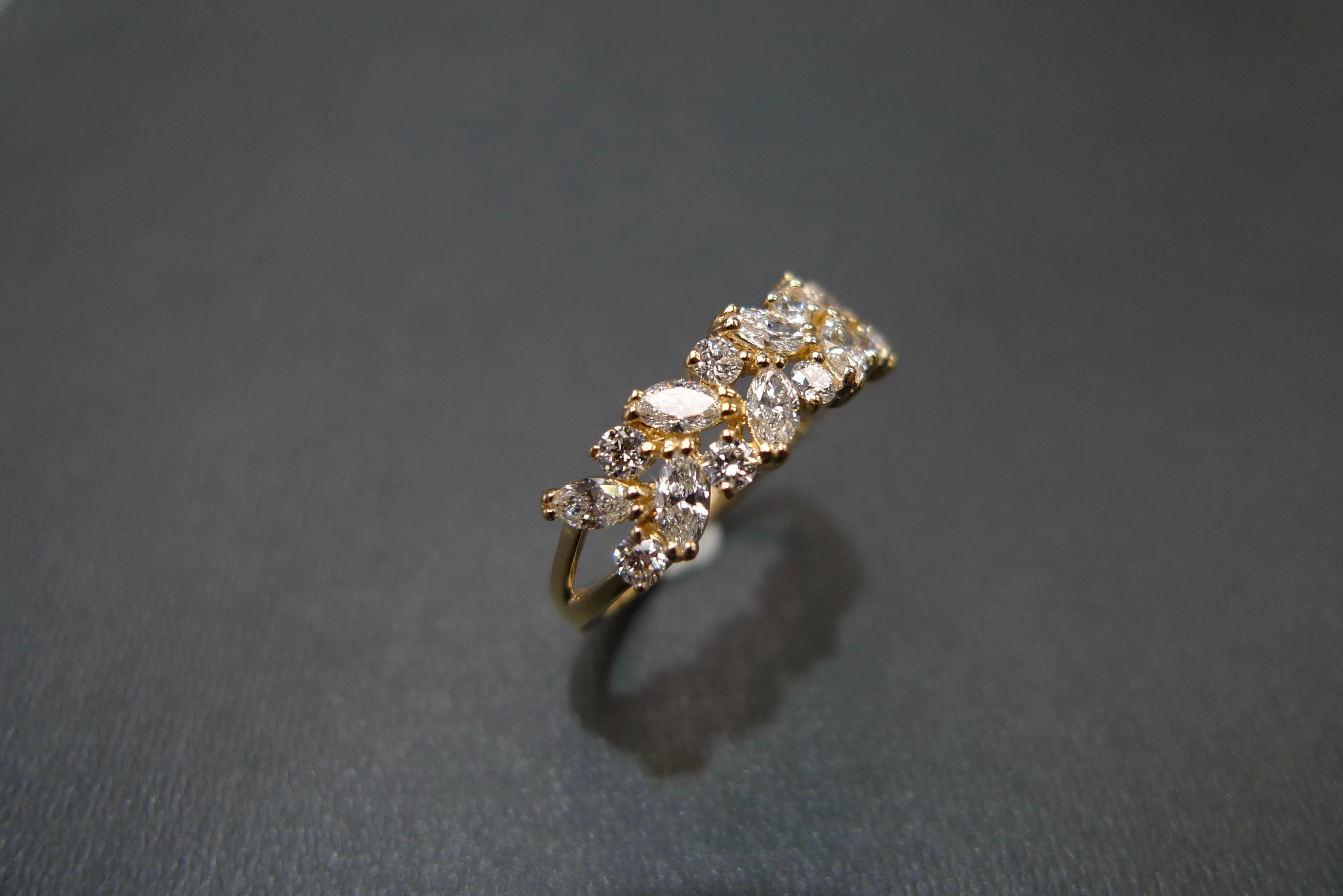 Marquise Cut Diamond and Round Brilliant Cut Diamond Ring in Yellow Gold