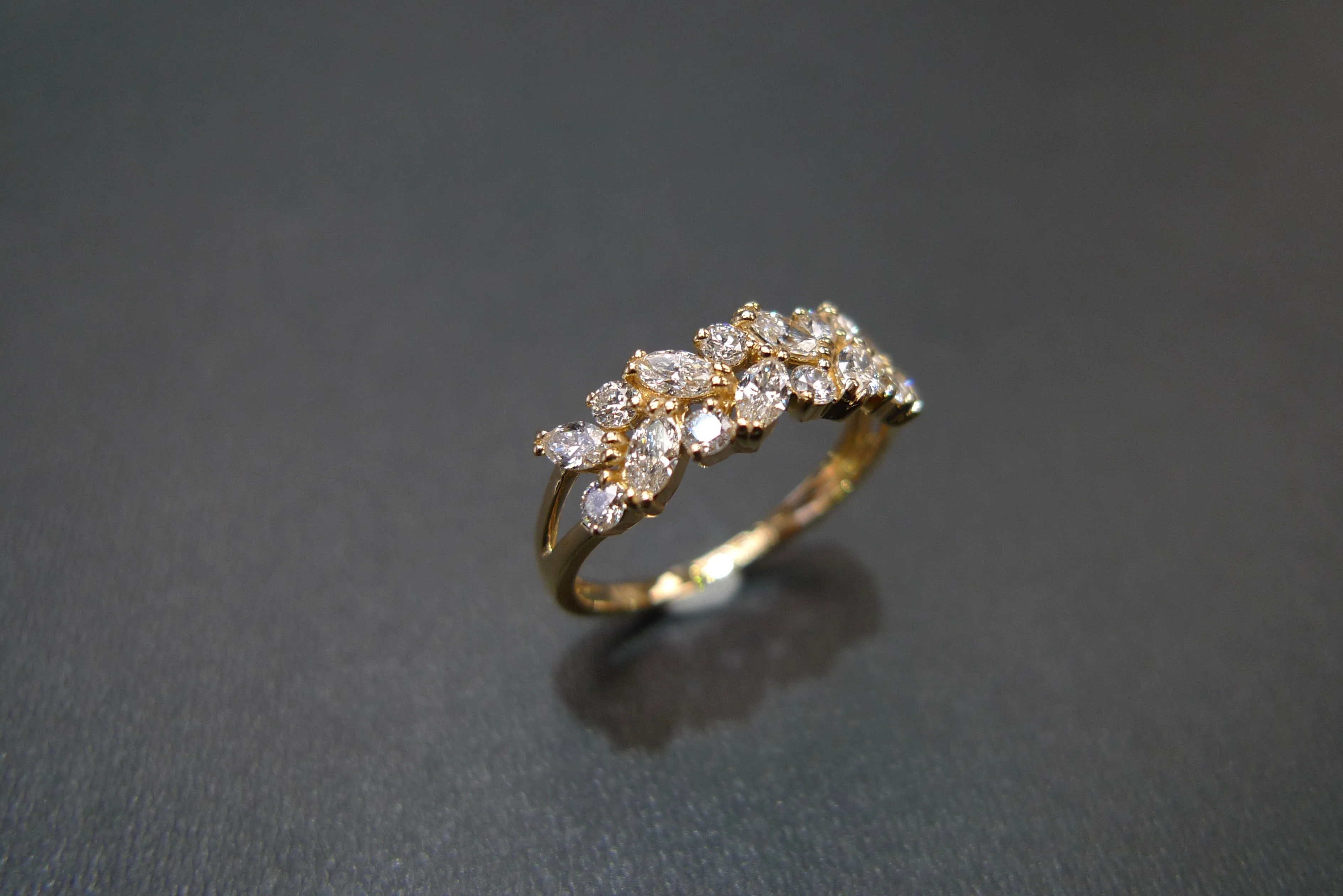 Marquise Cut Diamond and Round Brilliant Cut Diamond Ring in Yellow Gold