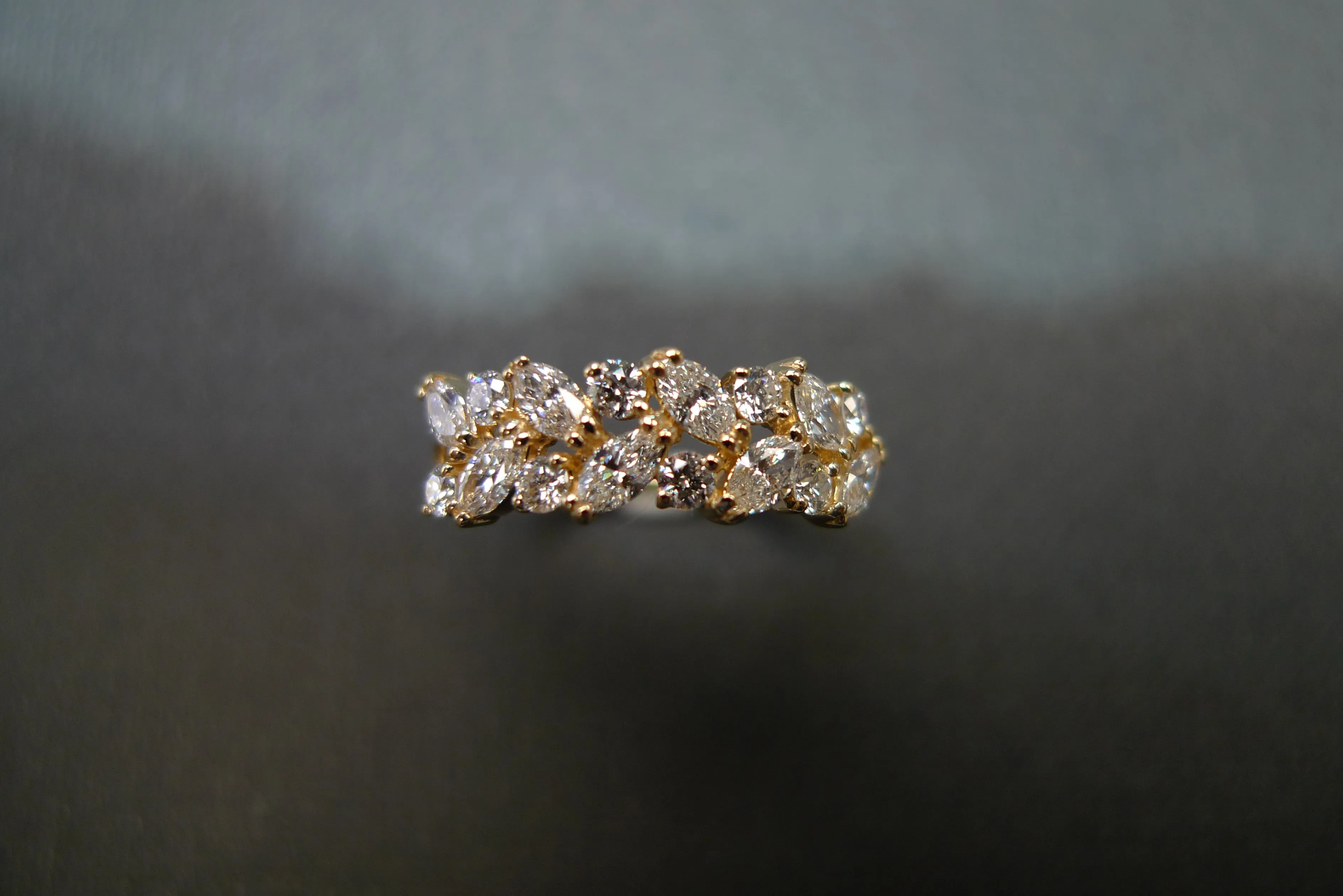 Marquise Cut Diamond and Round Brilliant Cut Diamond Ring in Yellow Gold