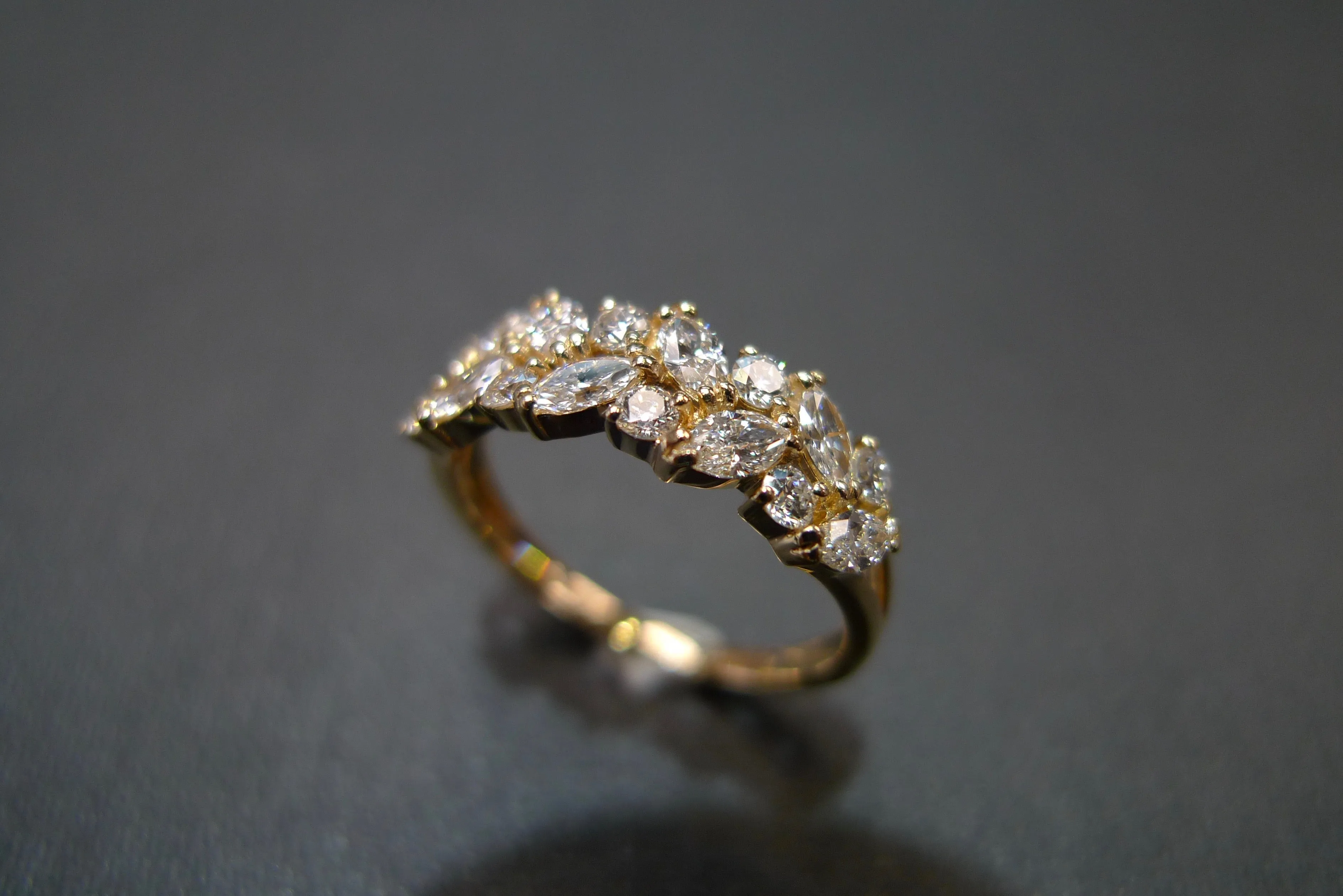 Marquise Cut Diamond and Round Brilliant Cut Diamond Ring in Yellow Gold