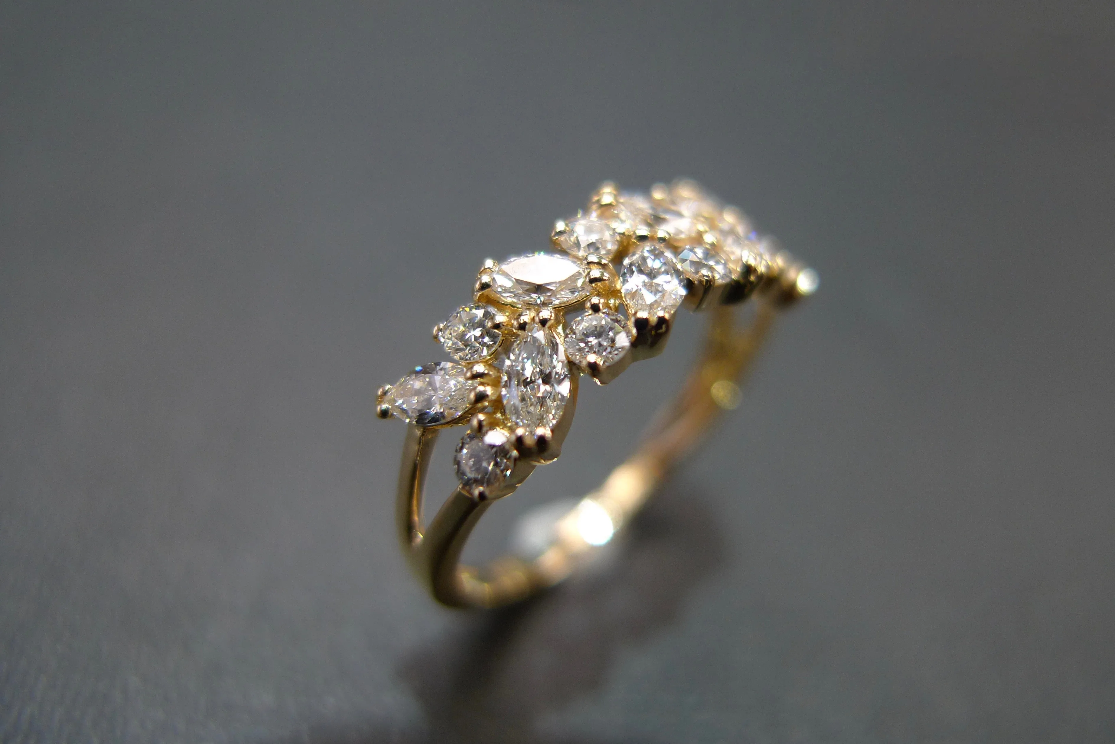 Marquise Cut Diamond and Round Brilliant Cut Diamond Ring in Yellow Gold