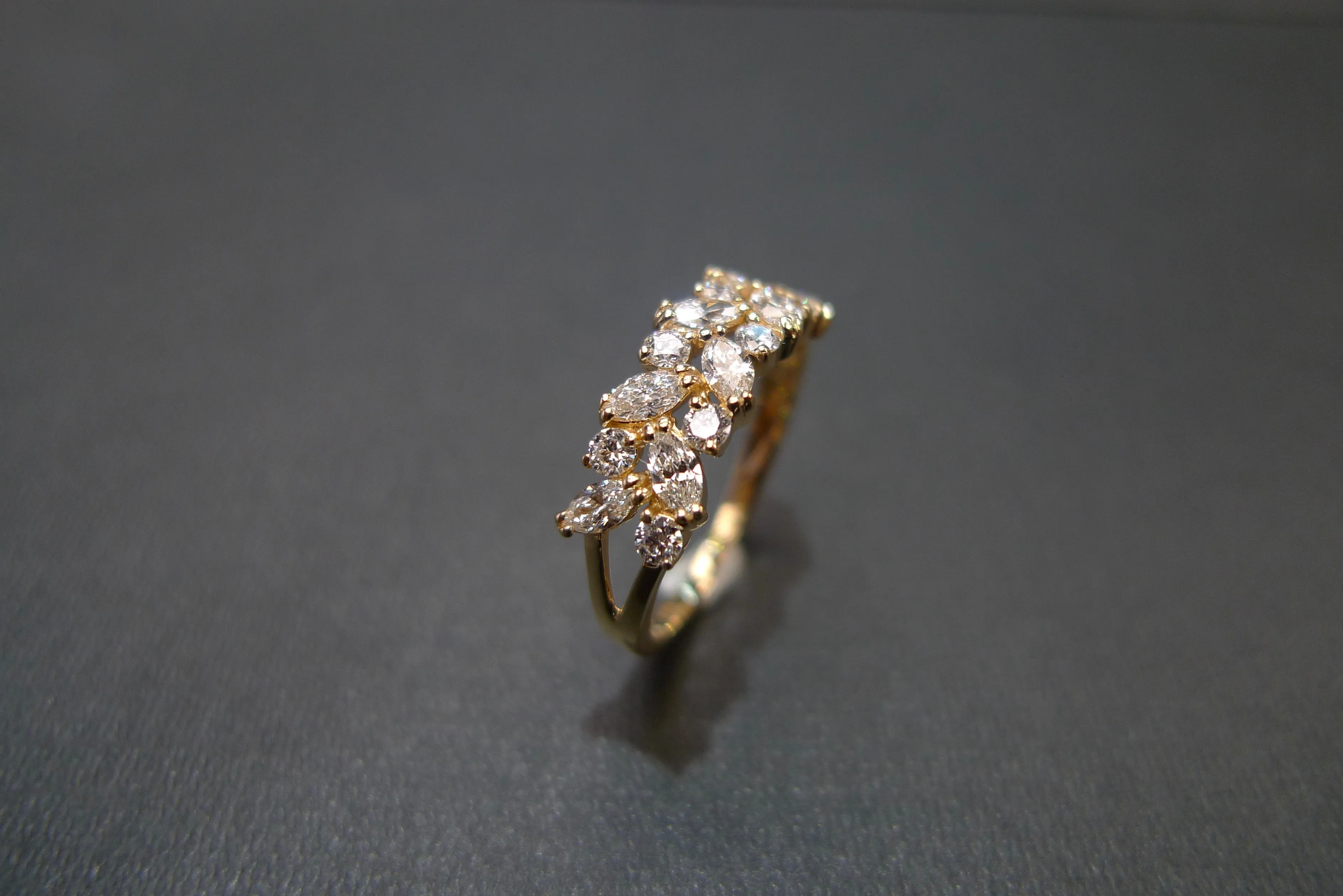 Marquise Cut Diamond and Round Brilliant Cut Diamond Ring in Yellow Gold