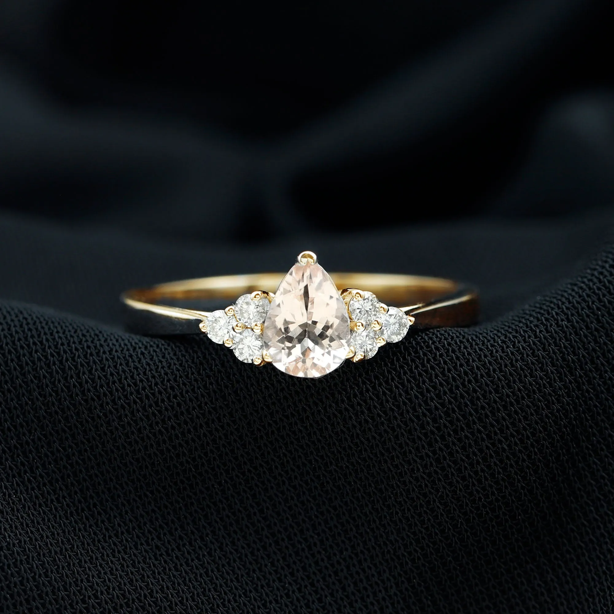 Pear Shaped Morganite Solitaire Ring with Diamond Trio