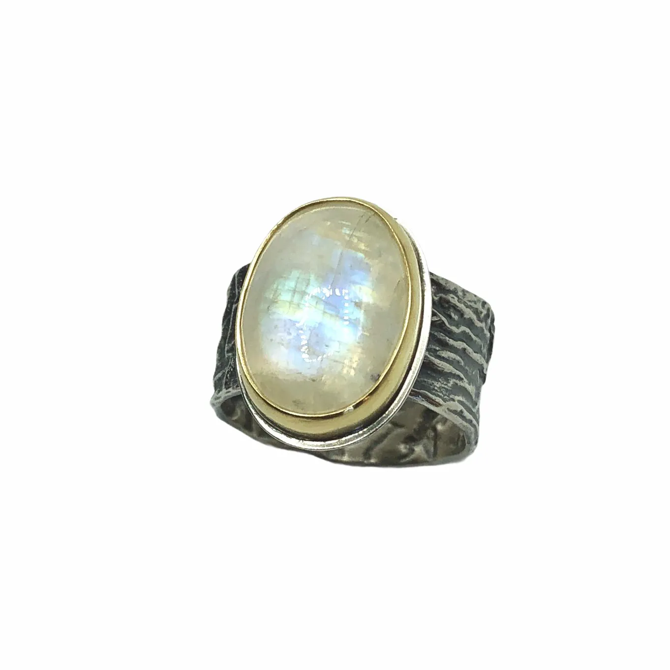 Rainbow Moonstone set in 18k gold bezel and reticulated silver band